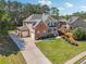 Charming brick home with a long driveway, green shutters, and a well-manicured lawn at 1829 Alcovy Shoals Blf, Lawrenceville, GA 30045