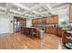 Spacious kitchen boasts wood cabinets, stainless steel appliances, and an oversized island with bar stool seating at 1829 Alcovy Shoals Blf, Lawrenceville, GA 30045