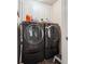 Laundry room featuring a modern washer and dryer at 1829 Alcovy Shoals Blf, Lawrenceville, GA 30045