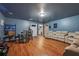 Spacious living room with wood floors, modern furniture, and neutral color scheme at 1829 Alcovy Shoals Blf, Lawrenceville, GA 30045