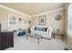 Cozy living room featuring neutral decor, plush seating, and ample natural light at 1829 Alcovy Shoals Blf, Lawrenceville, GA 30045