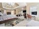 Bright, luxurious main bedroom suite with fireplace, tray ceilings, sitting area and ensuite bath at 1829 Alcovy Shoals Blf, Lawrenceville, GA 30045