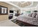 Luxurious main bedroom suite with fireplace, tray ceilings, sitting area and ensuite bath at 1829 Alcovy Shoals Blf, Lawrenceville, GA 30045