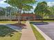 Landscaped walkway and pergola leading to community tennis courts, offering a scenic outdoor recreational area at 1829 Alcovy Shoals Blf, Lawrenceville, GA 30045