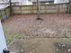 View of the backyard with a wood fence and fallen leaves, creating a serene and private outdoor space at 2019 Briar Creek Ne Ct, Conyers, GA 30012