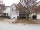 Charming two-story home featuring a one-car garage and a cozy front porch, located on a street at 2019 Briar Creek Ne Ct, Conyers, GA 30012