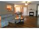 Open living room with hardwood floors, fireplace, and decorative details, blending style and comfort at 2019 Briar Creek Ne Ct, Conyers, GA 30012