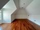 Attic area with hardwood floors and a large window with natural light at 4060 San Marco Way, Douglasville, GA 30135
