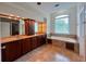 Bathroom featuring a double vanity, soaking tub and natural light at 4060 San Marco Way, Douglasville, GA 30135