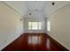 Bright bedroom with hardwood floors, tray ceiling and natural light through windows at 4060 San Marco Way, Douglasville, GA 30135