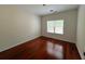 Bedroom featuring hardwood floors, neutral walls, and a window at 4060 San Marco Way, Douglasville, GA 30135