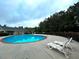 Inviting community pool features lounge chairs for relaxation by the sparkling water at 4060 San Marco Way, Douglasville, GA 30135