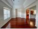 Elegant dining room featuring hardwood floors, large window, decorative trim, open to the kitchen and living area at 4060 San Marco Way, Douglasville, GA 30135