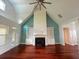 Bright and airy living room featuring hardwood floors, built-in bookshelves, and a fireplace with backyard views at 4060 San Marco Way, Douglasville, GA 30135