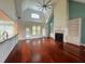 Spacious living room with a fireplace, built-in bookshelves, and hardwood floors, open to the kitchen at 4060 San Marco Way, Douglasville, GA 30135