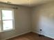 Bright bedroom with wood floors, a large window for natural light, and neutral-colored walls offering a serene space at 75 Oak Hill Dr, Covington, GA 30016