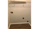 Laundry room space with hookups, featuring vinyl flooring and a clean, neutral interior at 75 Oak Hill Dr, Covington, GA 30016