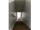 View of the stairway showing neutral walls, wood steps and minimalist trim at 75 Oak Hill Dr, Covington, GA 30016