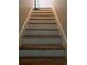 Stairway leading upwards, painted with white risers and wooden steps, offering a clean and classic transition at 75 Oak Hill Dr, Covington, GA 30016