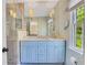 Modern bathroom featuring marble countertops, a glass enclosed shower and soft patterned wallpaper at 770 Wellesley Nw Dr, Atlanta, GA 30305