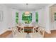 Bright dining area with a bay window with green outdoor view at 770 Wellesley Nw Dr, Atlanta, GA 30305