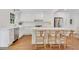 Beautiful kitchen featuring stainless steel appliances, white cabinetry, and island seating at 770 Wellesley Nw Dr, Atlanta, GA 30305