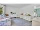 Spacious living room with white storage units, large window and light blue rug at 770 Wellesley Nw Dr, Atlanta, GA 30305