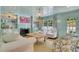 Elegant living room with fireplace, built-in shelving, a beaded chandelier, and white furniture with patterned accents at 770 Wellesley Nw Dr, Atlanta, GA 30305