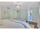 Bedroom featuring striped wallpaper, an elegant four-poster bed, and access to the bathroom at 770 Wellesley Nw Dr, Atlanta, GA 30305