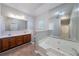 Bright bathroom with double vanity sinks, large tub, and shower at 12237 Cypress Ln, Fayetteville, GA 30215