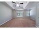 Spacious bedroom featuring a tray ceiling and carpet flooring at 12237 Cypress Ln, Fayetteville, GA 30215