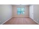 Neutral bedroom with natural light coming in from the window and carpet flooring at 12237 Cypress Ln, Fayetteville, GA 30215