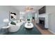 Bright living room featuring a fireplace, ceiling fan, and ample natural light at 12237 Cypress Ln, Fayetteville, GA 30215