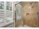 This tiled shower offers bright light and seating at 1435 Withmere Ln, Atlanta, GA 30338
