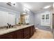 The bathroom boasts granite countertops, a large vanity, and a tiled shower at 1435 Withmere Ln, Atlanta, GA 30338