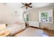 Bright bedroom with hardwood floors, shuttered windows, and ample natural light at 1435 Withmere Ln, Atlanta, GA 30338