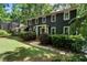 Classic two-story home with lush landscaping, stone pathway, and an inviting entrance at 1435 Withmere Ln, Atlanta, GA 30338