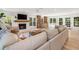 Bright living room features a fireplace, hardwood floors, and views of backyard and access to patio at 1435 Withmere Ln, Atlanta, GA 30338