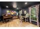 Sophisticated home office with dark walls, elegant lighting, and ample space for work or study at 1435 Withmere Ln, Atlanta, GA 30338