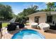 Inviting back deck with seating area, grill, and a refreshing above-ground pool; perfect for outdoor entertaining at 1608 Carroll Nw Dr, Atlanta, GA 30318