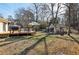 Large backyard with a deck, outdoor grill, ample space, and trees, ideal for outdoor gatherings and recreation at 1608 Carroll Nw Dr, Atlanta, GA 30318