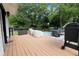 Backyard deck area features jacuzzi, seating, and a grill at 1608 Carroll Nw Dr, Atlanta, GA 30318