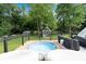 Backyard deck area with hot tub, shed and lush landscaping at 1608 Carroll Nw Dr, Atlanta, GA 30318