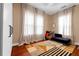 Well lit bedroom features large windows, hardwood floors, and warm toned walls at 1608 Carroll Nw Dr, Atlanta, GA 30318
