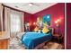 Bedroom showcases bright artwork, hardwood floors, and natural lighting at 1608 Carroll Nw Dr, Atlanta, GA 30318