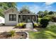 Charming home with a cozy front porch, a well-manicured lawn, and attractive landscaping, enhancing curb appeal at 1608 Carroll Nw Dr, Atlanta, GA 30318