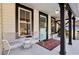 Cozy front porch with seating, stylish decor, and a welcoming entrance, perfect for relaxing and enjoying the outdoors at 1608 Carroll Nw Dr, Atlanta, GA 30318