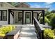 Charming front porch with black accents, offering a welcoming entry at 1608 Carroll Nw Dr, Atlanta, GA 30318