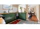 Bright kitchen featuring green cabinetry, wood countertops, stainless appliances, and geometric tile flooring at 1608 Carroll Nw Dr, Atlanta, GA 30318