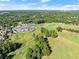 Aerial view of the golf course and clubhouse at 3282 Green Farm Trl, Dacula, GA 30019